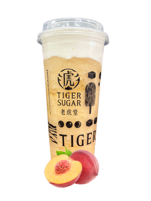 Peach drink in a clear cup with foam topping, Tiger Sugar logo, with peach halves in front.