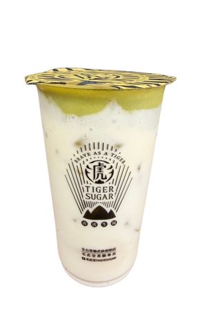 Tiger Sugar bubble tea with milk splash.