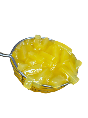 Yellow pasta in a metal strainer, close-up, against a white background.