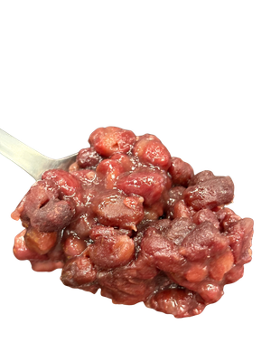 Red bean dessert on a spoon, close-up.