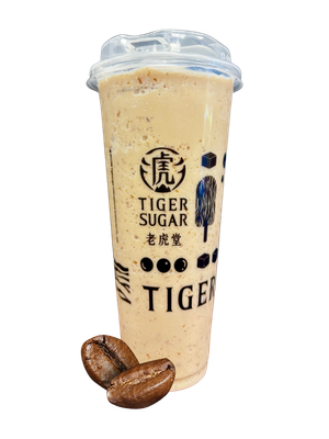 Tiger Sugar coffee drink in a clear plastic cup with coffee beans.
