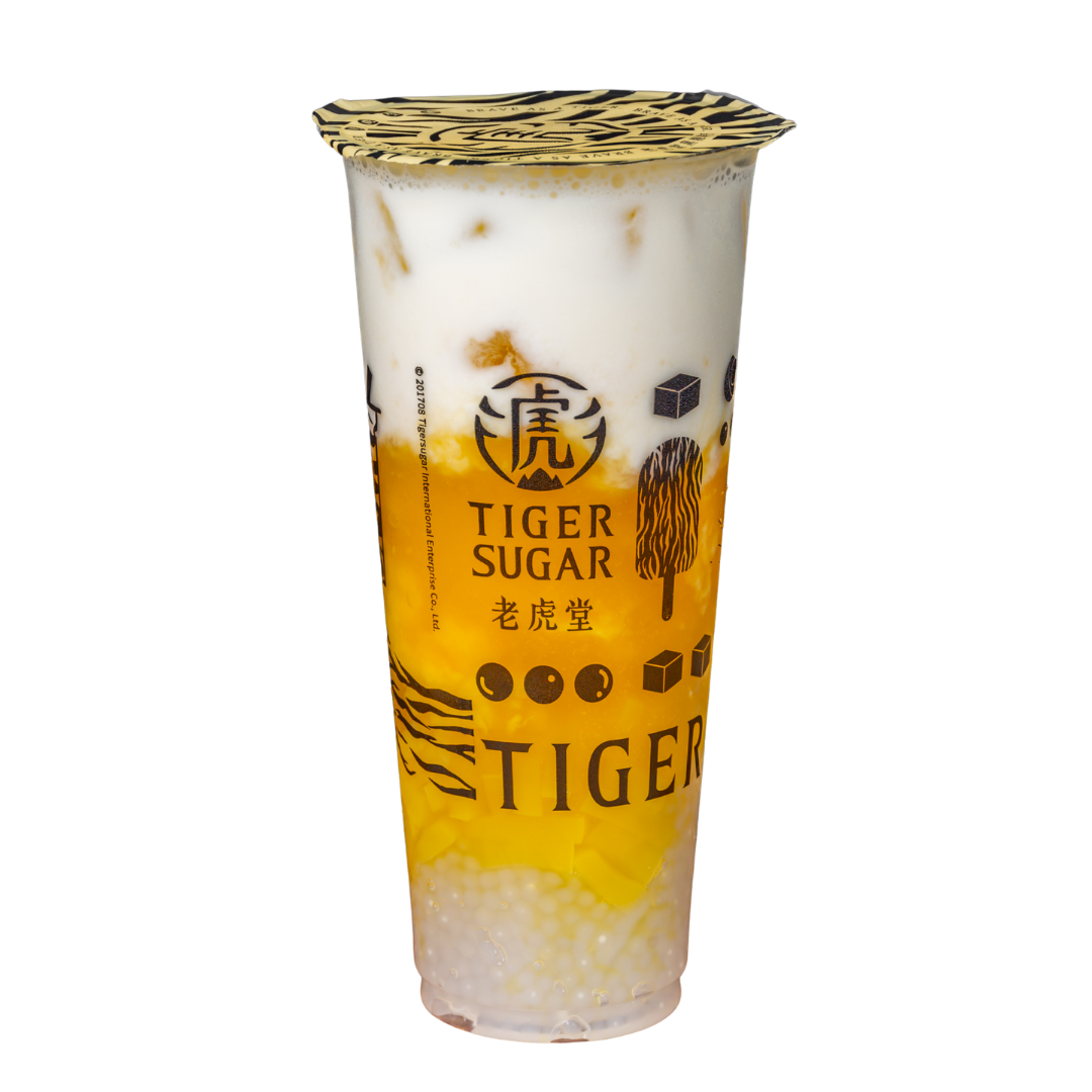 Tiger Sugar mango bubble tea, layered with yellow mango, white milk, and brown tapioca pearls.
