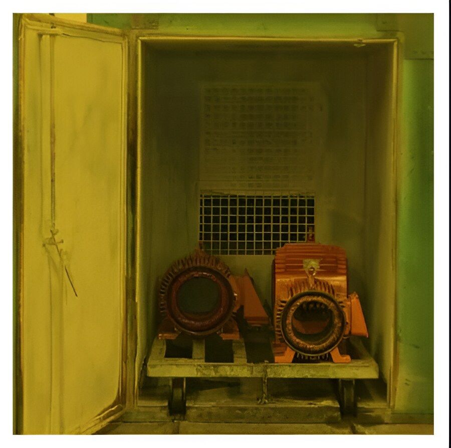 Two Motors Are Sitting Inside of a Yellow Box — Davidson's Electrical In Parkhurst, QLD