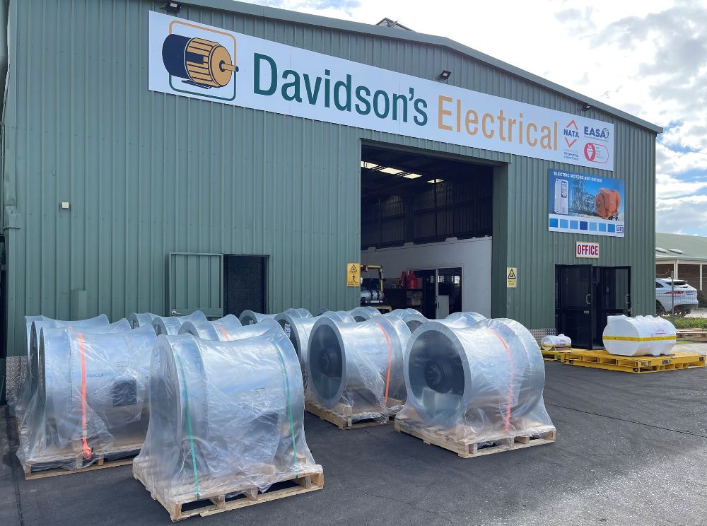A green building with a sign that says davidson 's electrical - Davidson's Electrical In Parkhurst, QLD