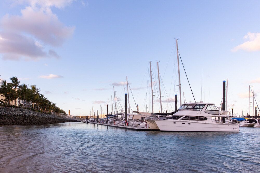 A Group of Boats Are Docked in a Marina — Davidson's Electrical In Mackay, QLD