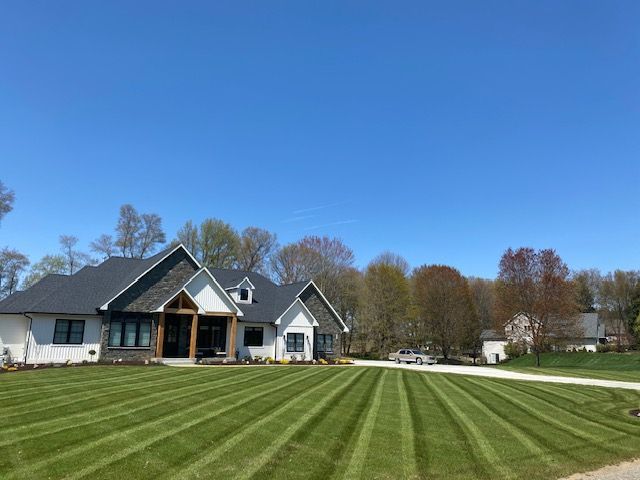 residential home with landscaped yard