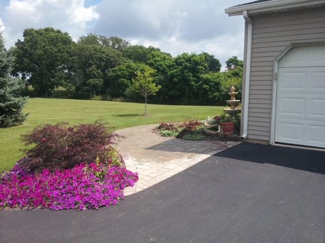 residential home with landscaped yard