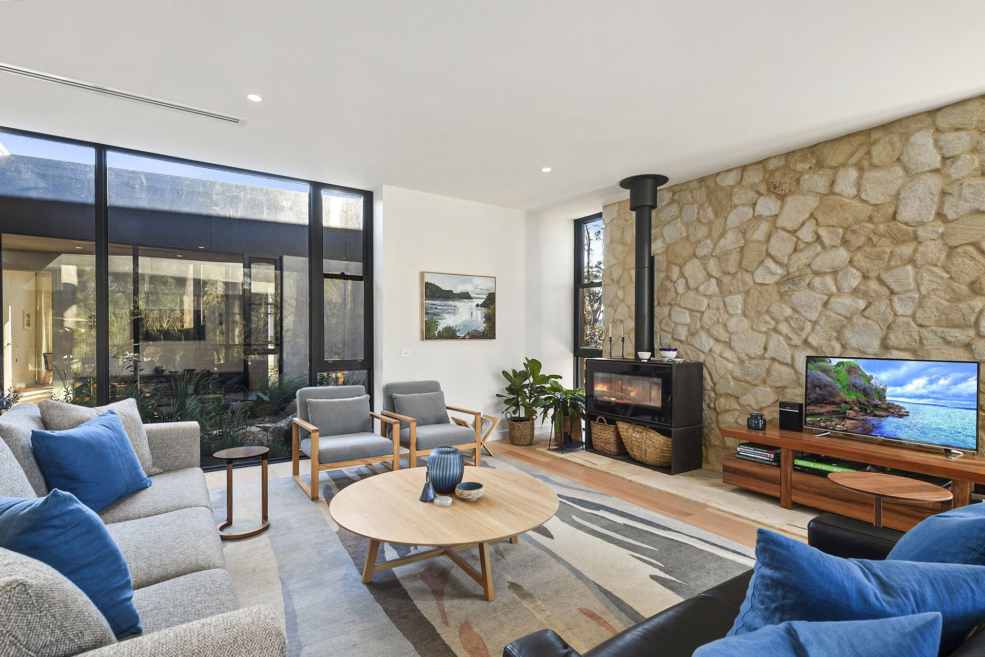 A living room filled with furniture and a flat screen tv.