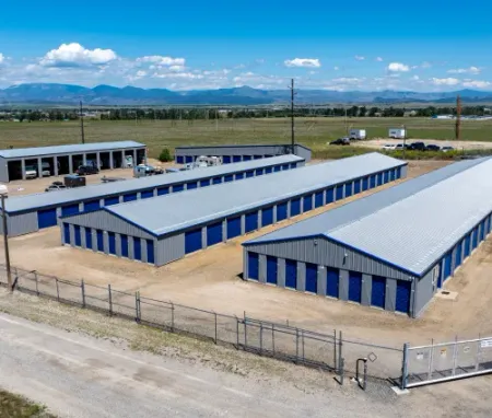 aerial view of storage units surrounded by a fence