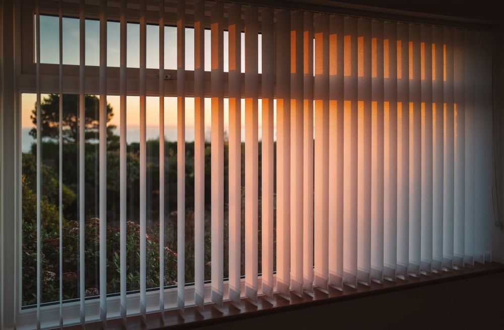 The Sun is Shining Through the Vertical Blinds on the Window — Lismore Blinds in North Lismore, NSW