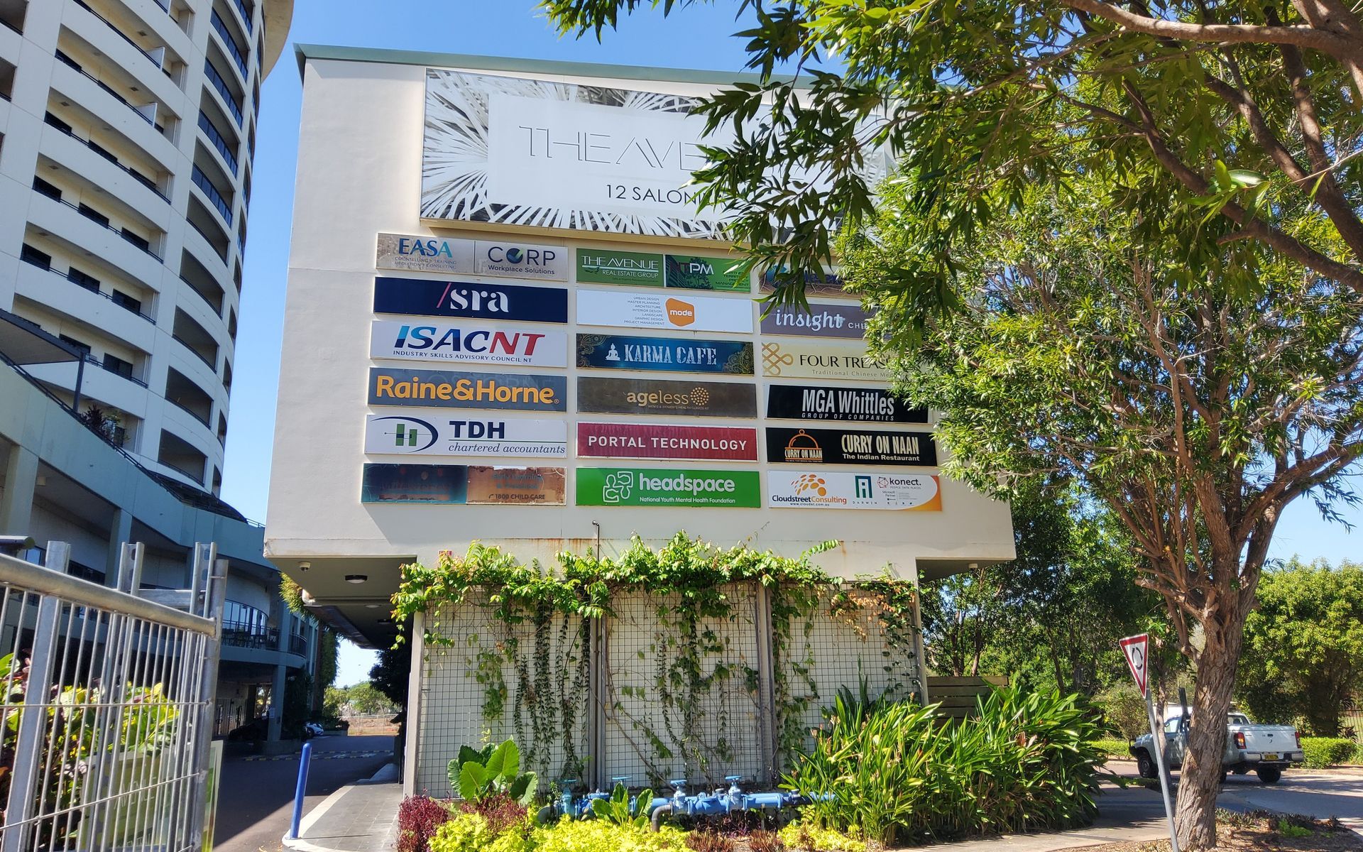 Signage of Various Businesses on a Building Exterior — EXPOSURE NORTH PLASTERING PTY LTD in Berry Springs, NT