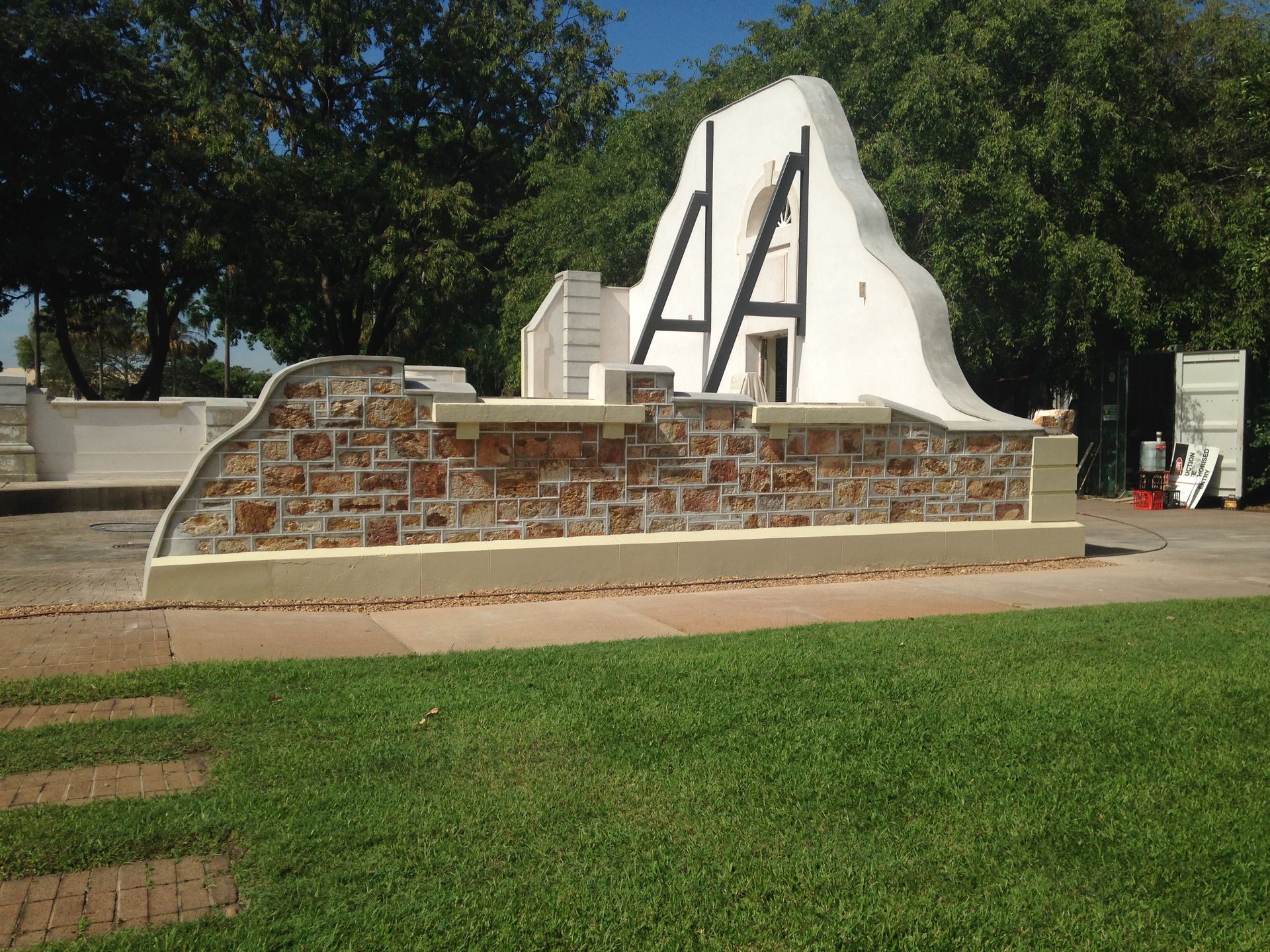 Stone Wall With White Structure, Black Beams, in Park — EXPOSURE NORTH PLASTERING PTY LTD in Berry Springs, NT