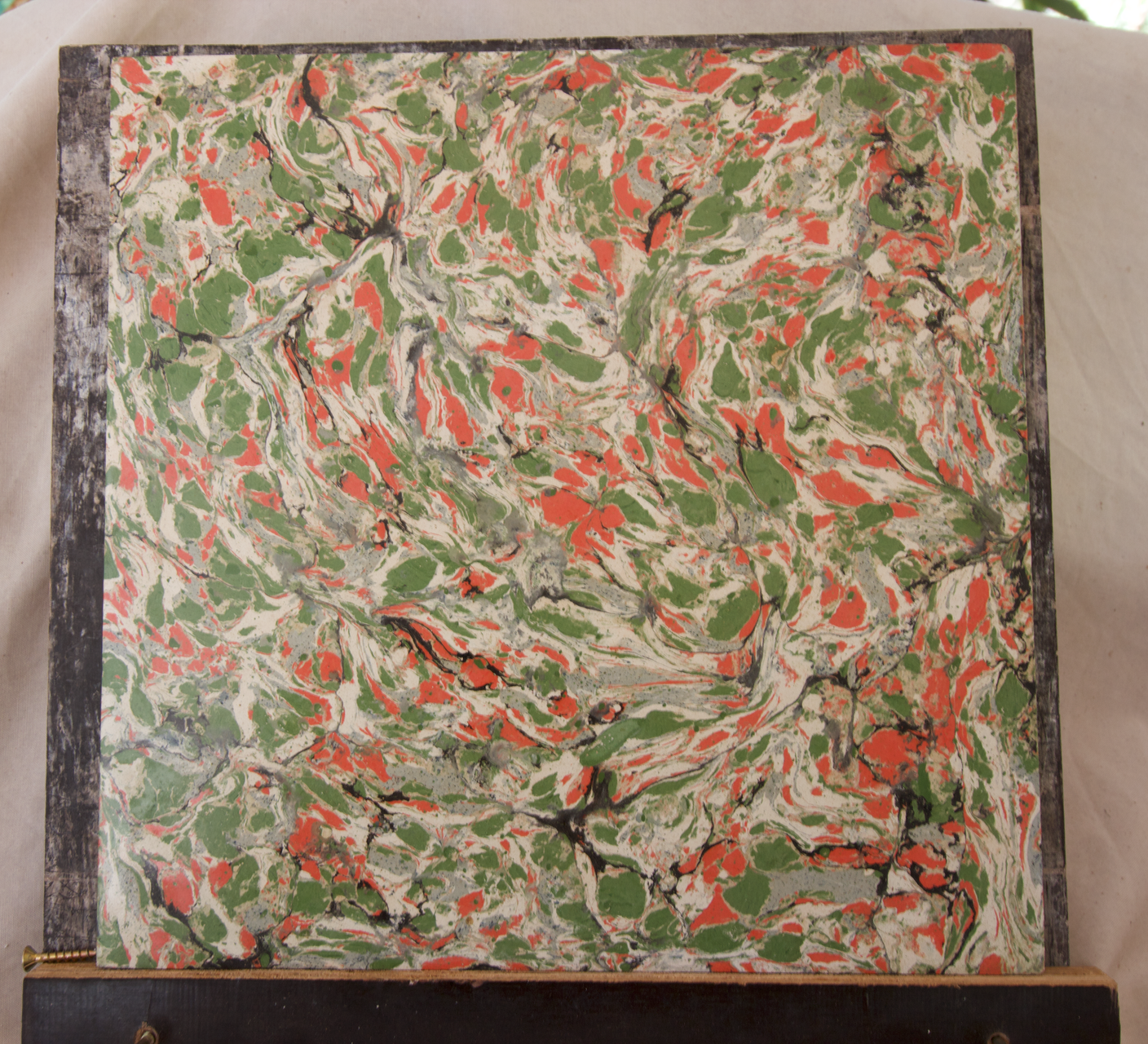 Square Panel with Green, Orange, and White Marbled Pattern — EXPOSURE NORTH PLASTERING PTY LTD in Berry Springs, NT