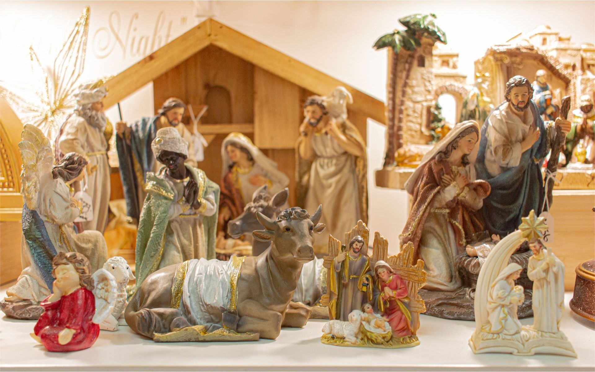 A nativity scene is sitting on top of a white table.