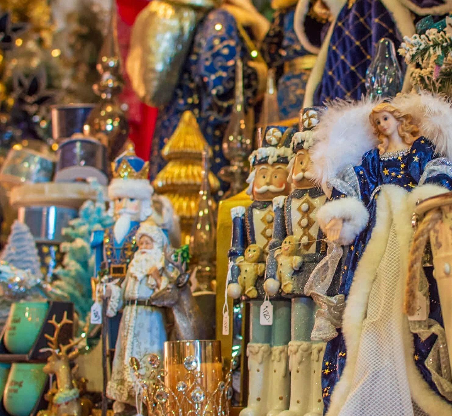 A bunch of christmas decorations are sitting on a table.