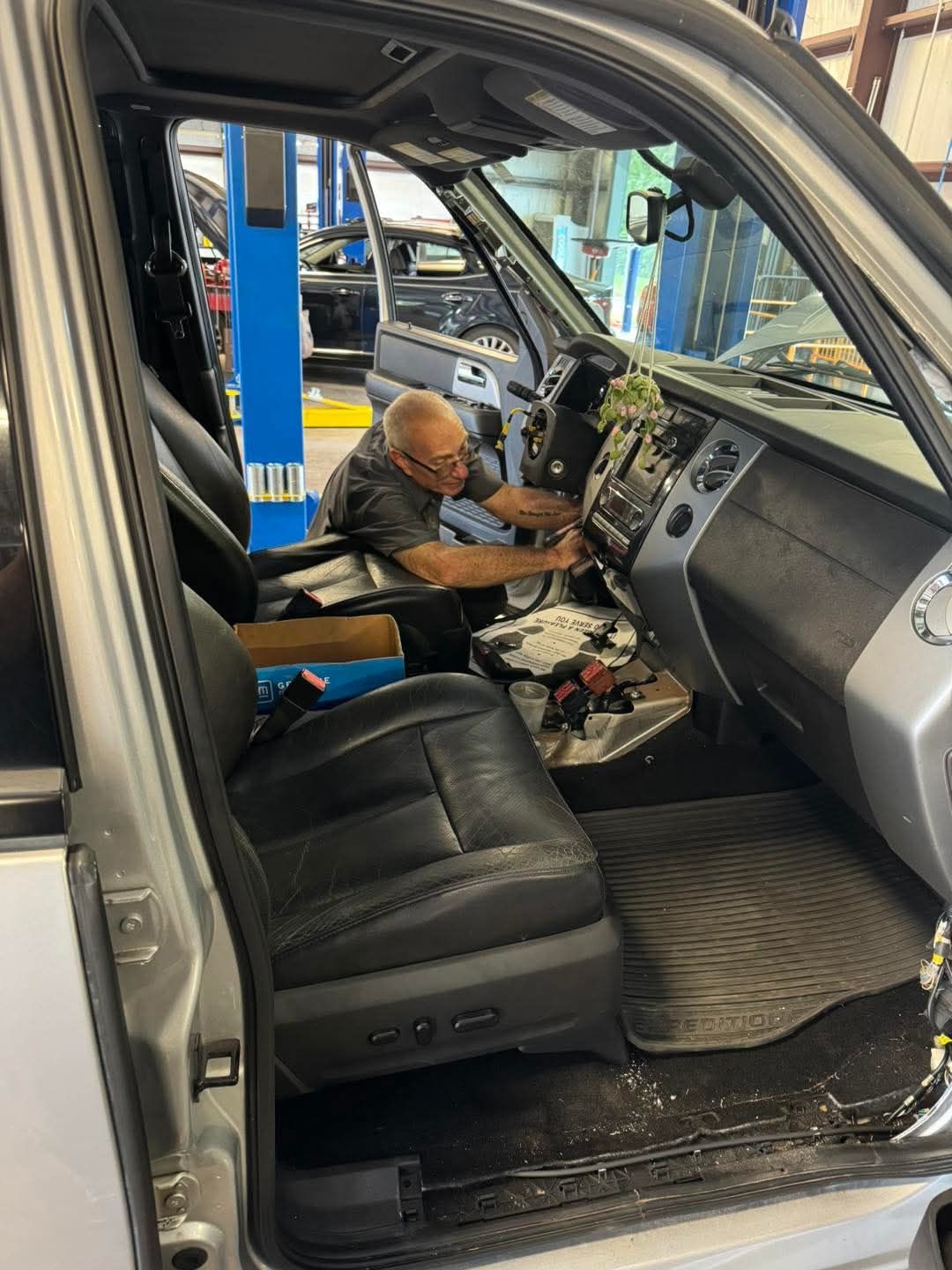 Specialists — Technician and Client Looking at Car in Orange Park, FL