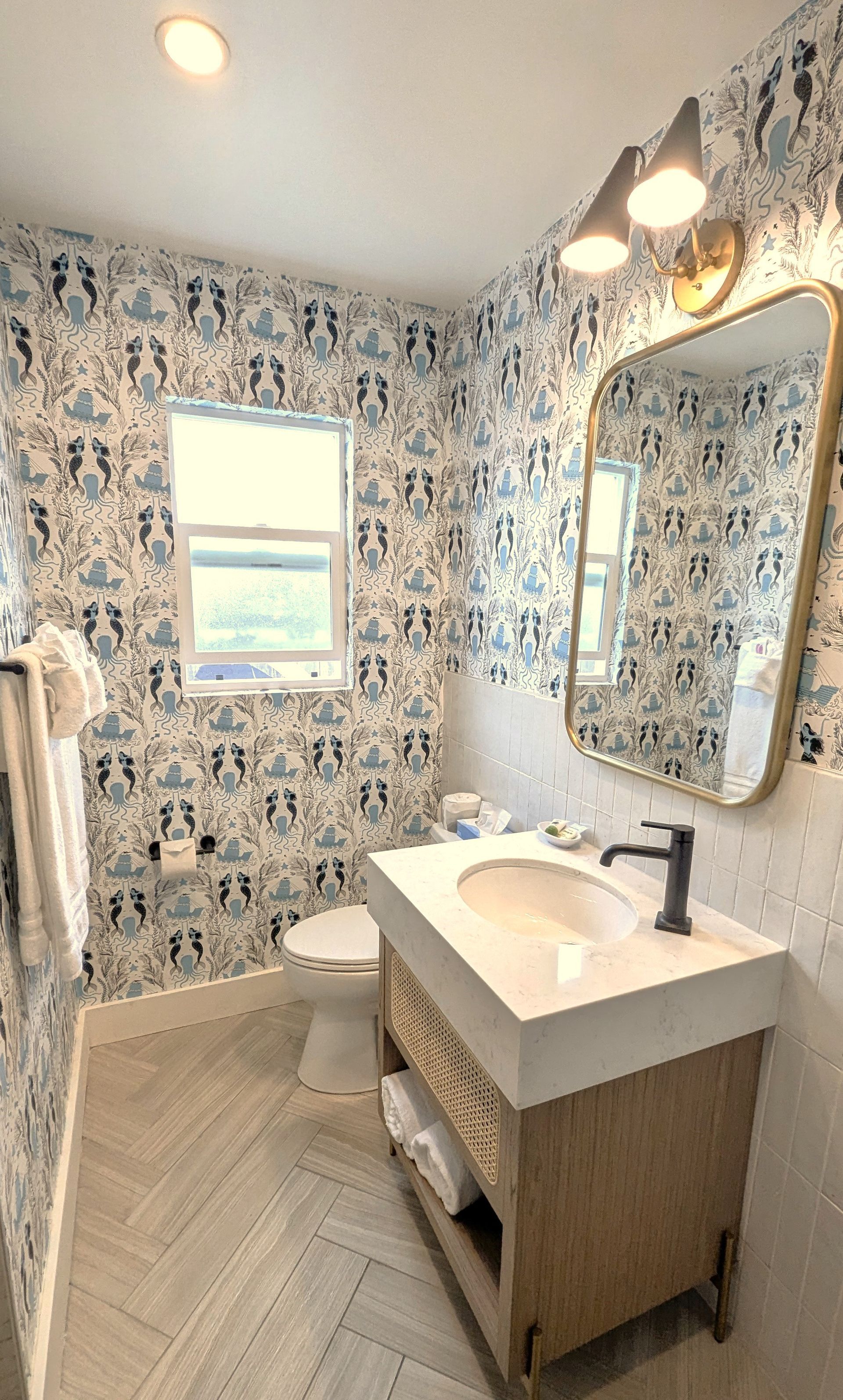 Bathroom with blue, mermaid  print wallpaper