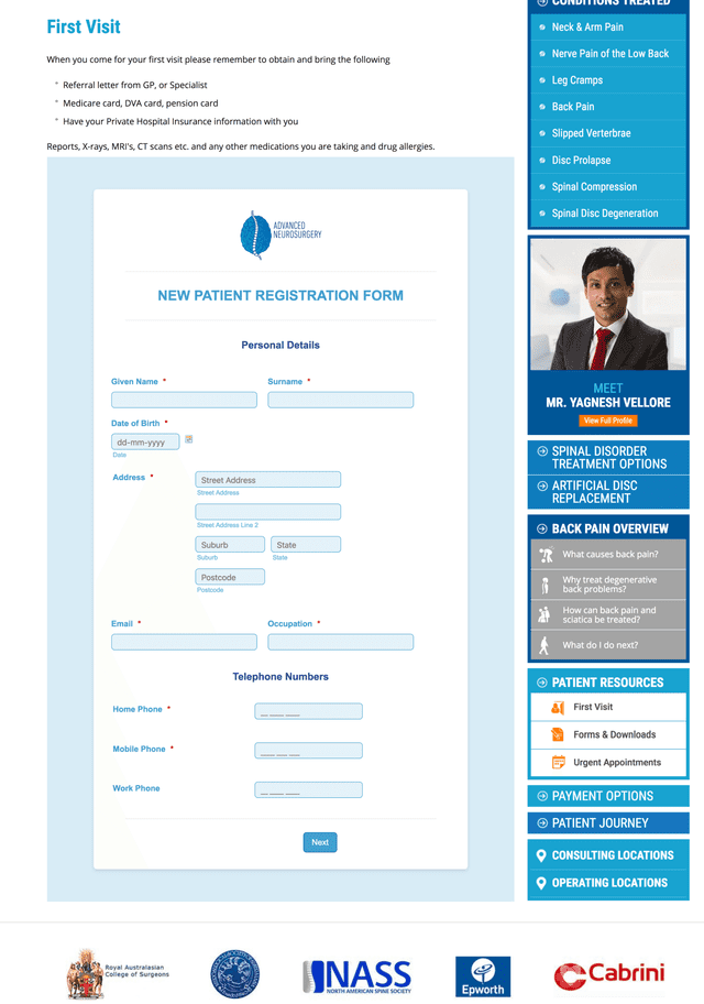 A man in a suit and tie is filling out a form on a website.