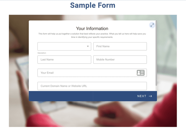 A person is filling out a sample form on a laptop