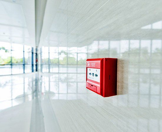 Red Fire Alarm On White Wall — Birmingham, AL — Automatic Fire Systems Red Fire Alarm On White Wall — Birmingham, AL — Automatic Fire Systems
