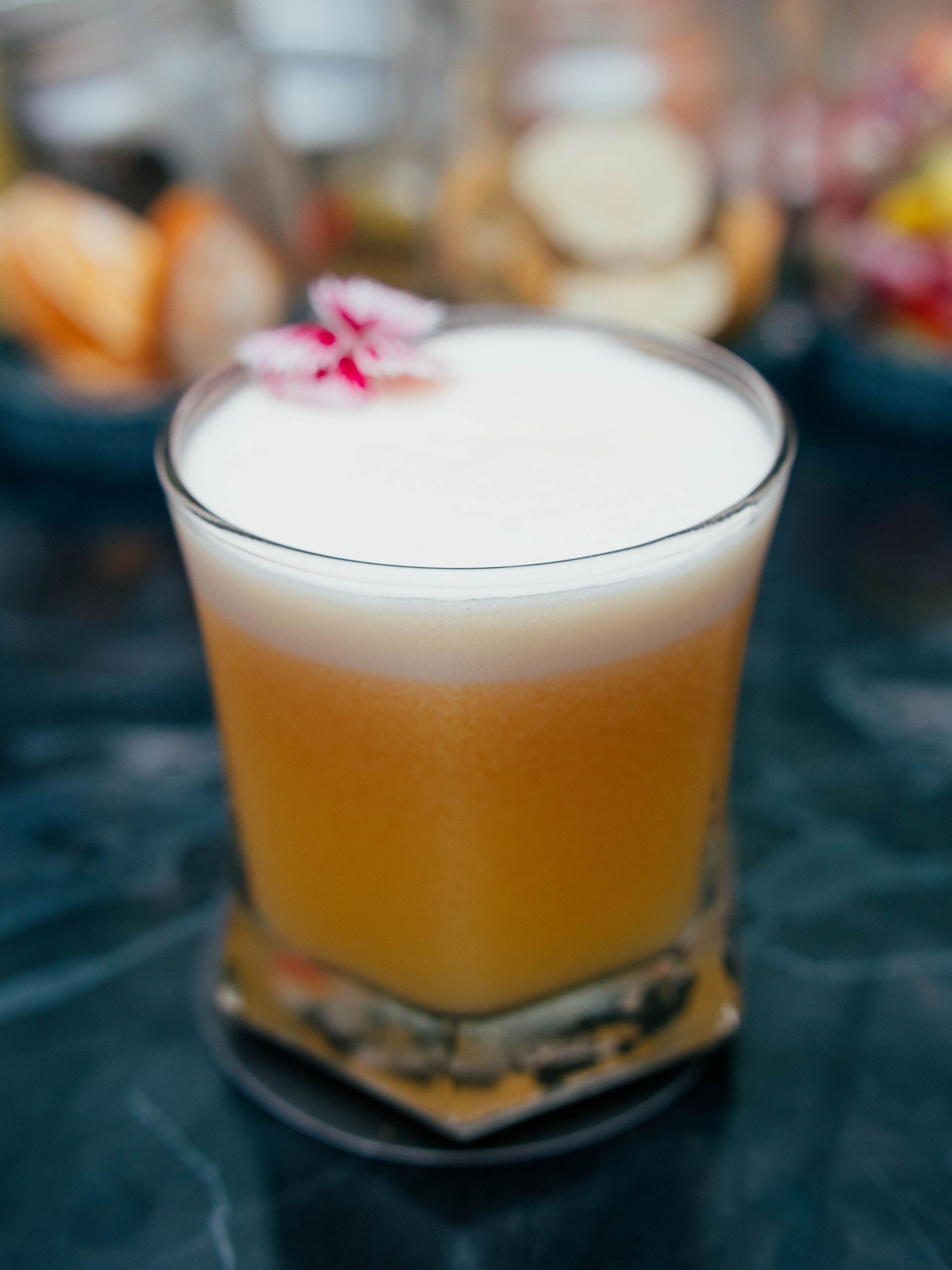 A close up of a drink in a glass on a table