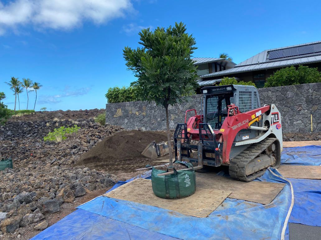 A bulldozer is sitting on top of a blue tarp doing excavation.
