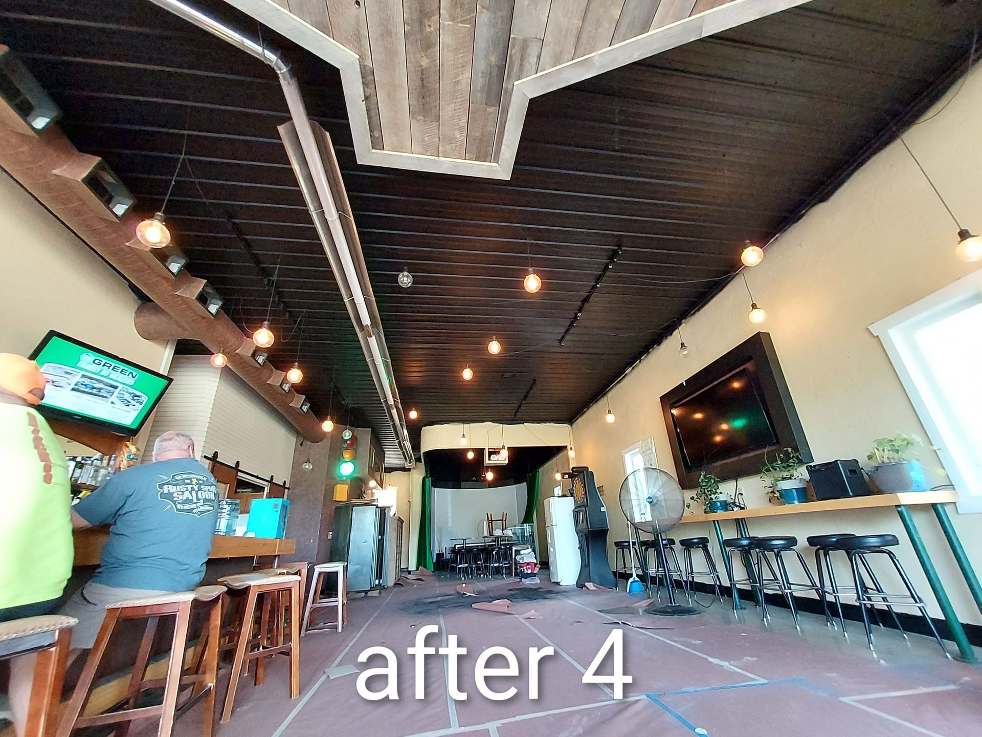 Bar with high stools and TVs, a few people seated, and “after 4” text overlay.