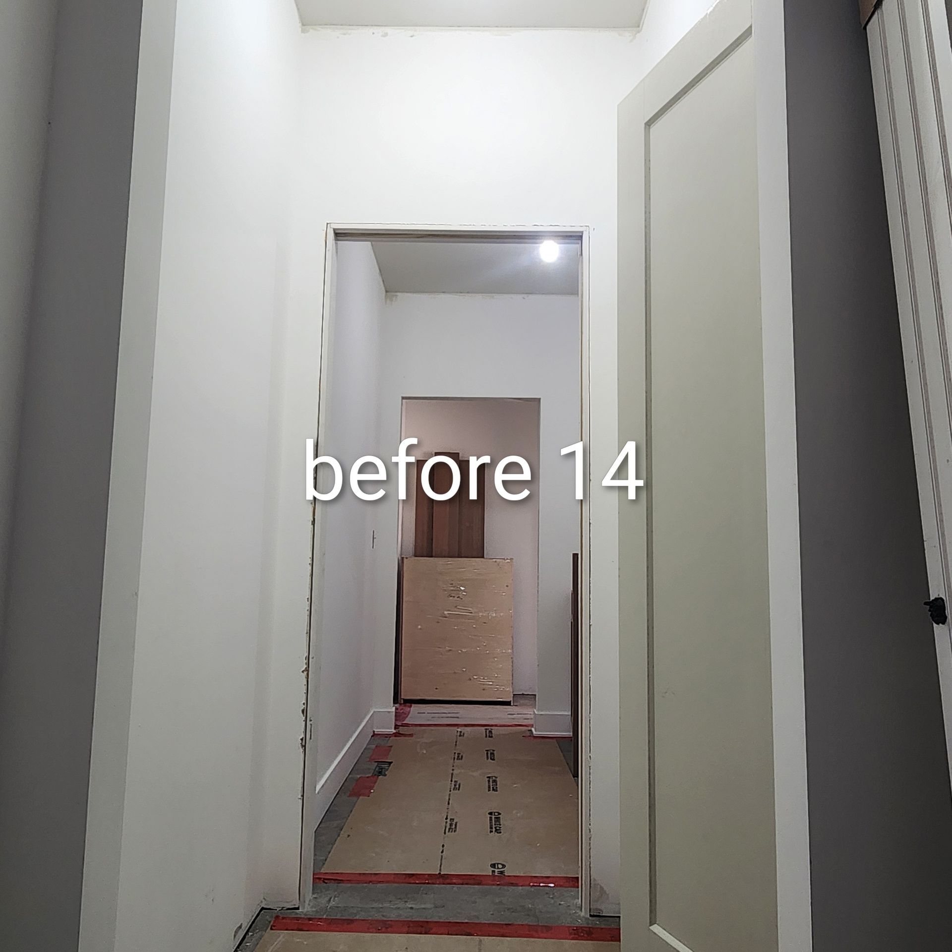 Narrow white hallway with a doorway, cardboard box at the far end, and “before 14” text overlay.