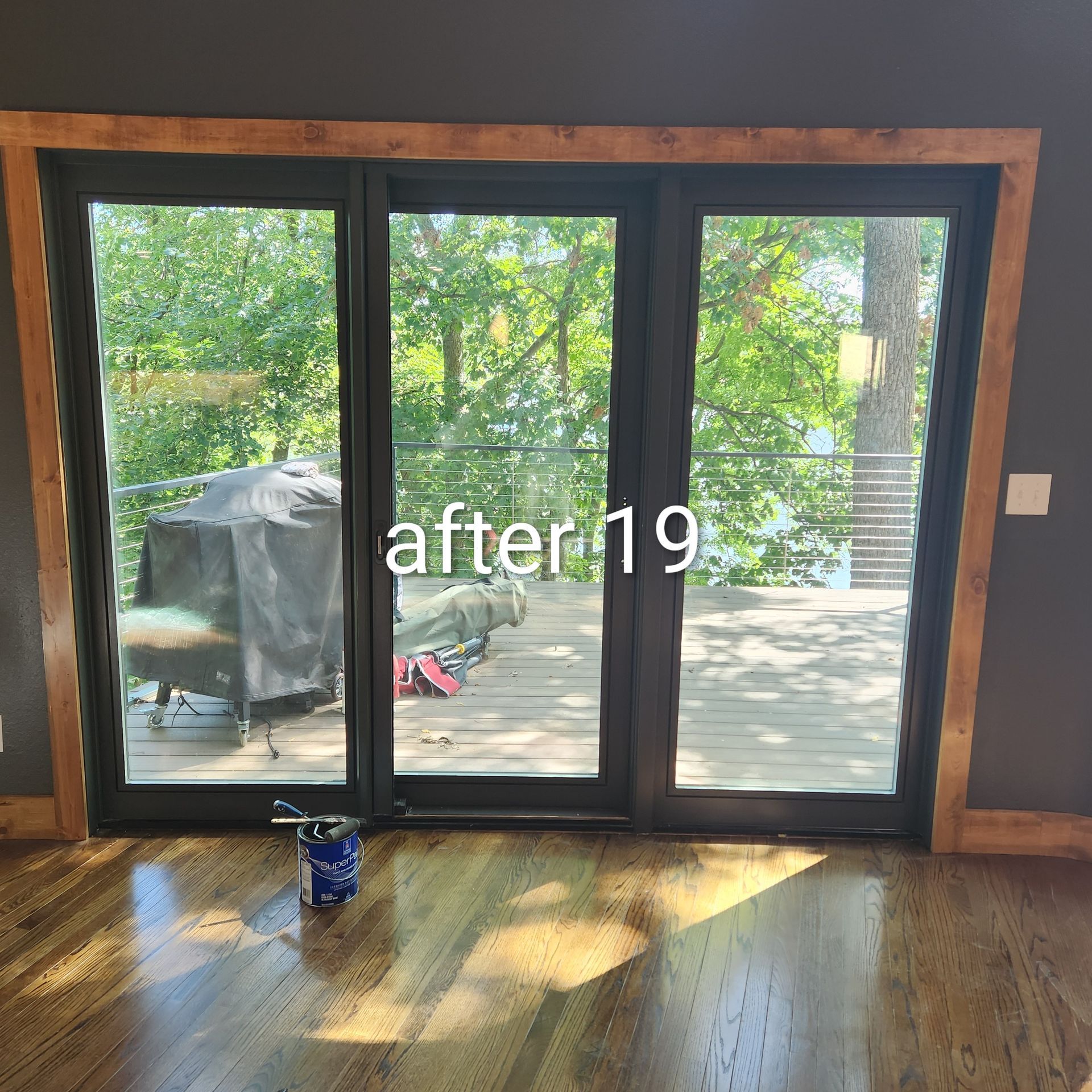 Sliding glass doors opening to a sunlit deck and green trees, with “after19” text overlaid.