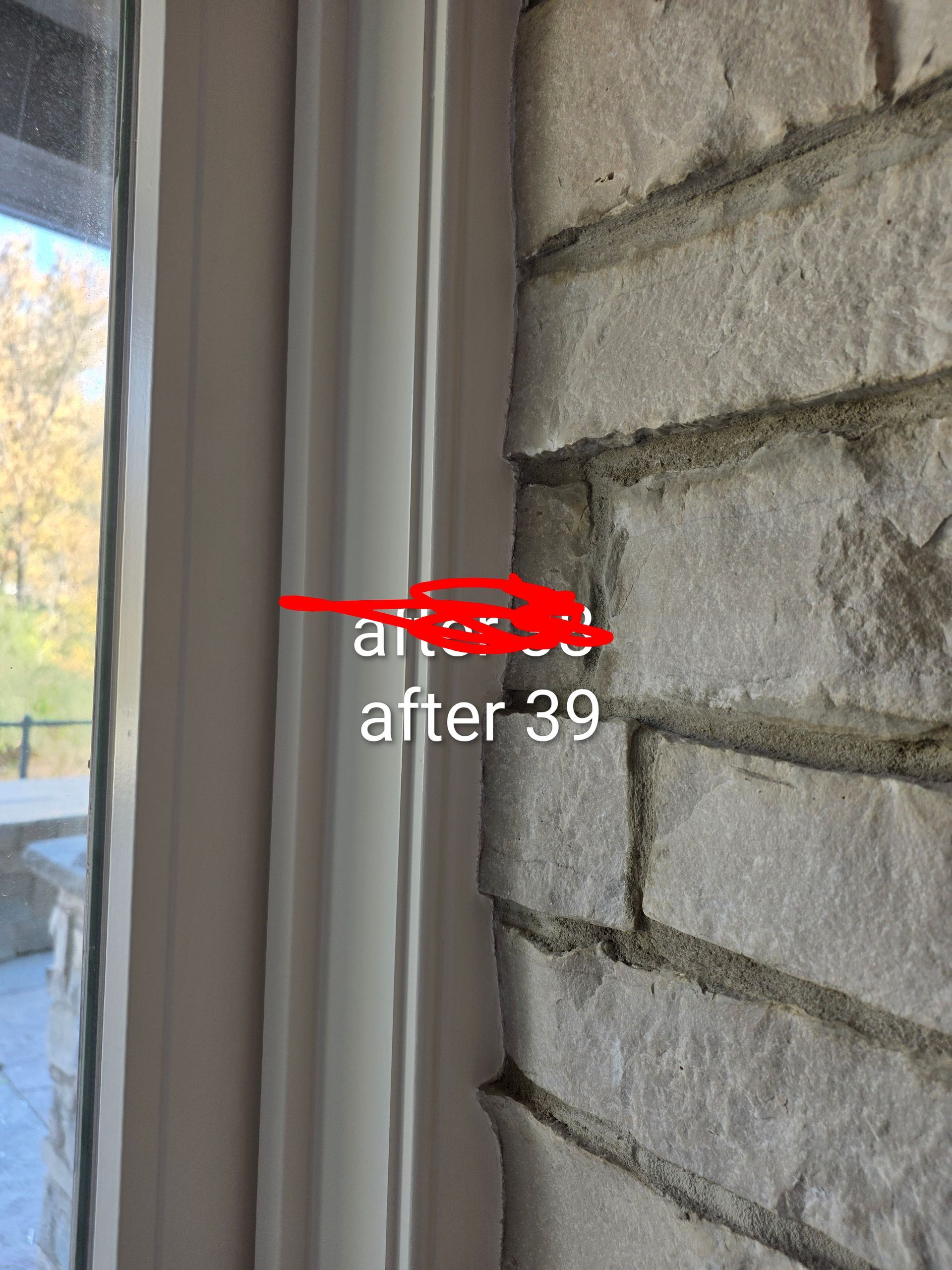 Window trim beside a stone wall, with a small white text overlay reading “after 39.”