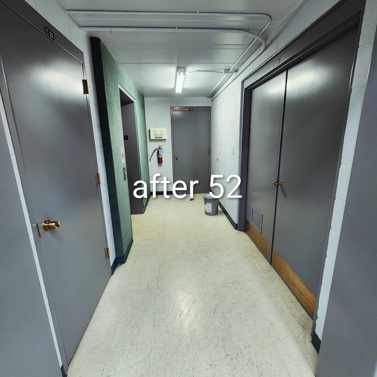 Narrow office hallway with gray walls and doors, fluorescent lights, and “after 52” text overlay.