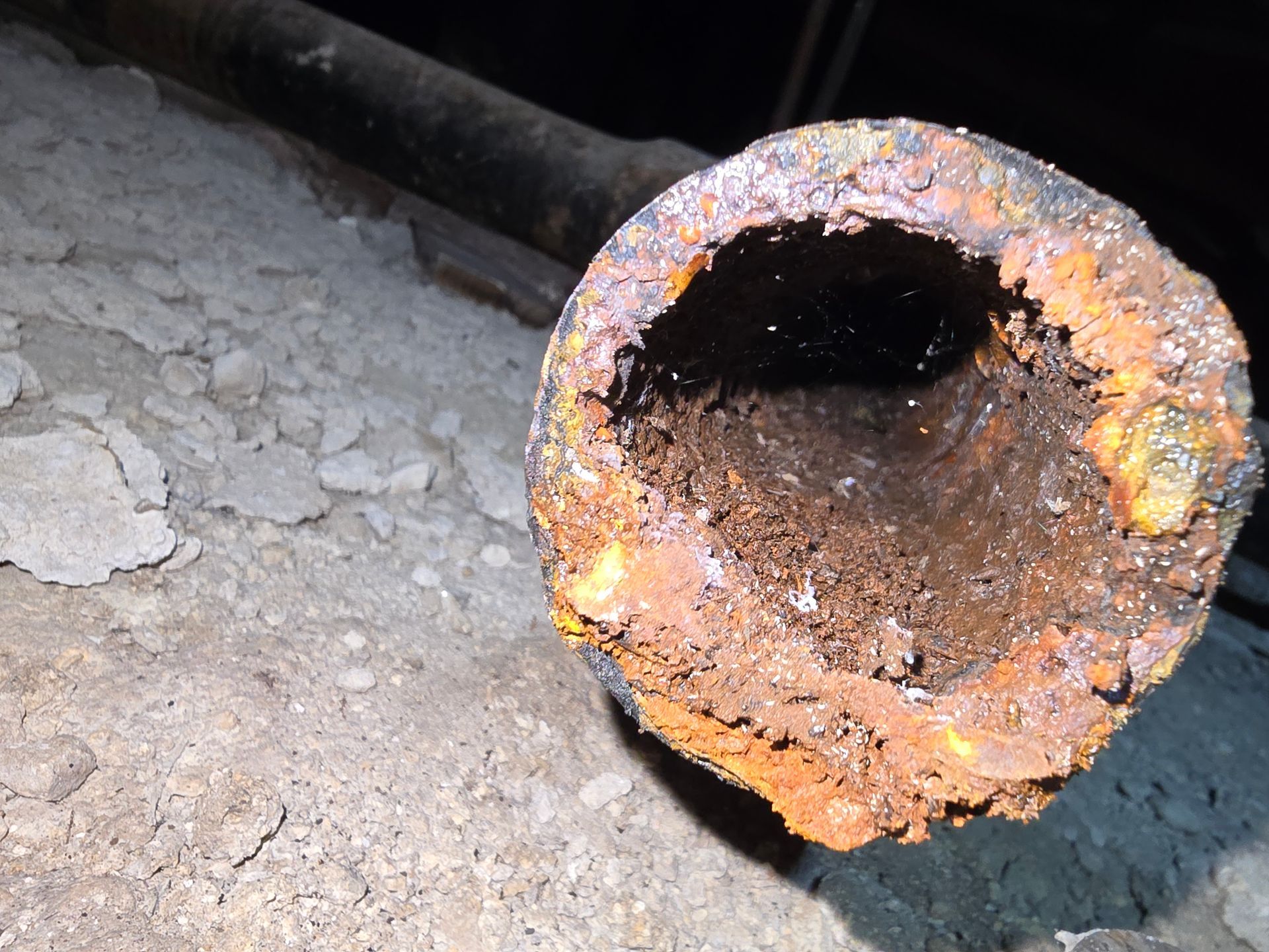 inside of old deteriorated cast iron pipe