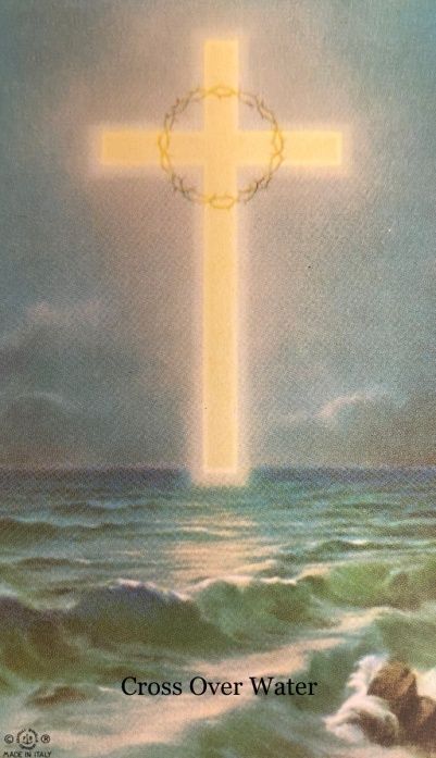 A picture of a cross in the ocean with the words `` cross over water '' below it.