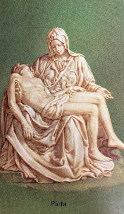 A statue of a woman holding a corpse of jesus