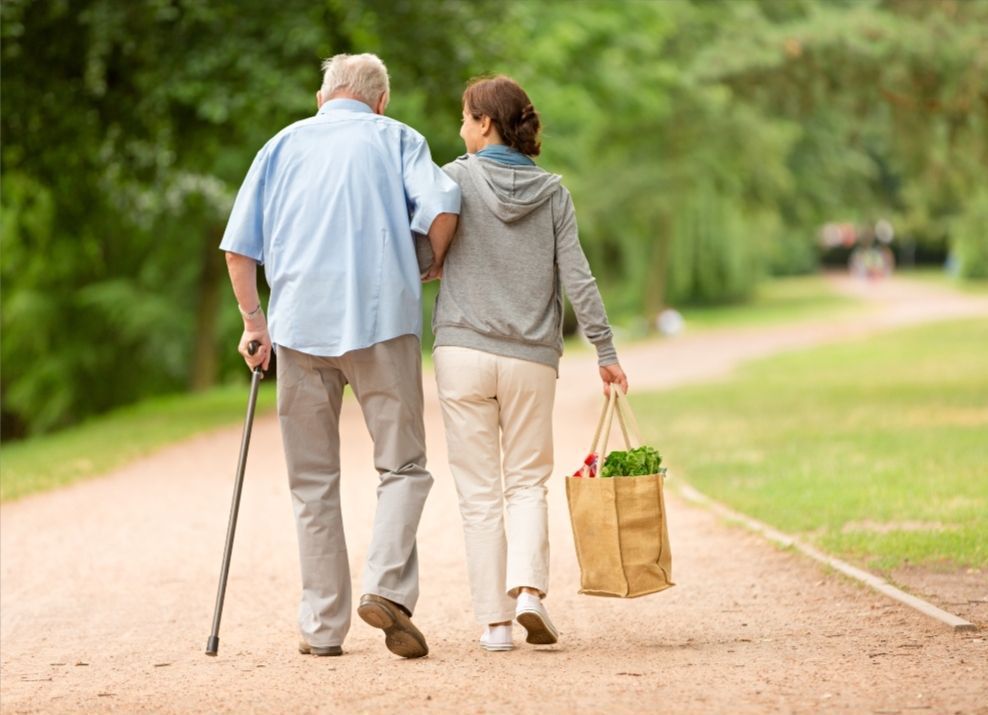 Care taker and senior walking
