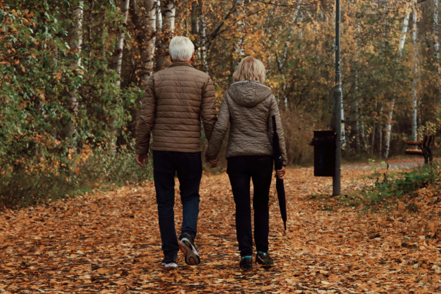 two seniors walking in fall