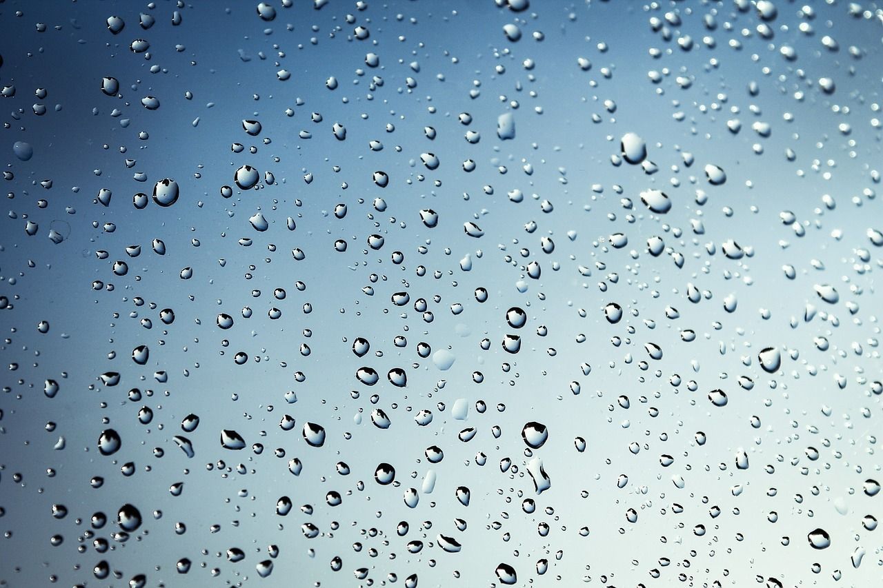 Water Droplets on a Reflective, Blue-gray Surface — 1 Time Waterproofing In East Ballina, NSW