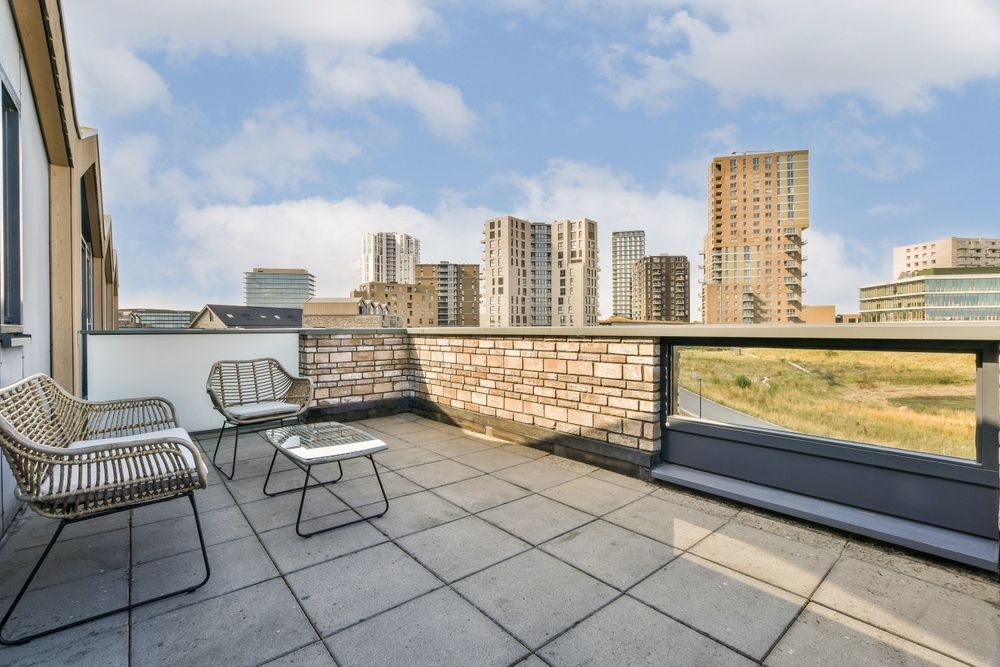 Outdoor Patio With Seating and City Skyline View — 1 Time Waterproofing In East Ballina, NSW