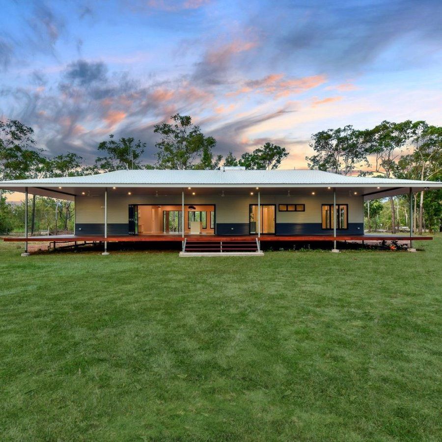 A House With A Porch And A Large Lawn In Front Of It — SLS Builders Pty Ltd in Humpty Doo, NT