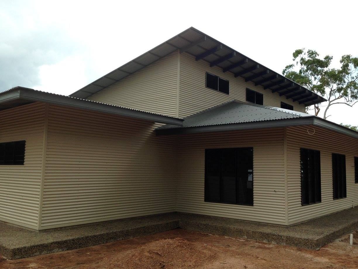 A White House With Black Windows And A Metal Roof — SLS Builders Pty Ltd in Palmerston, NT 