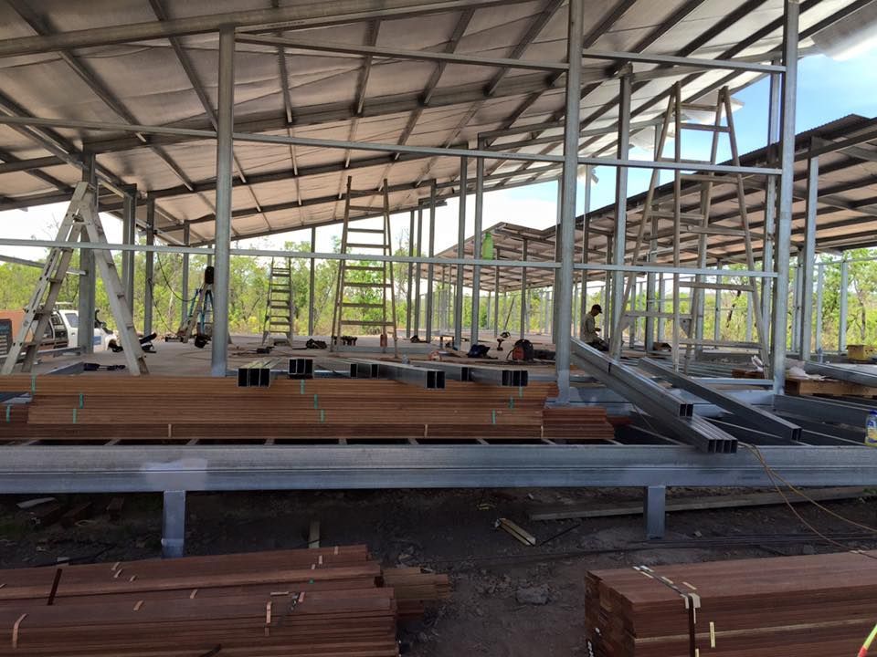 A Large Building Under Construction With A Lot Of Wood And Metal — SLS Builders Pty Ltd in Yarralin, NT
