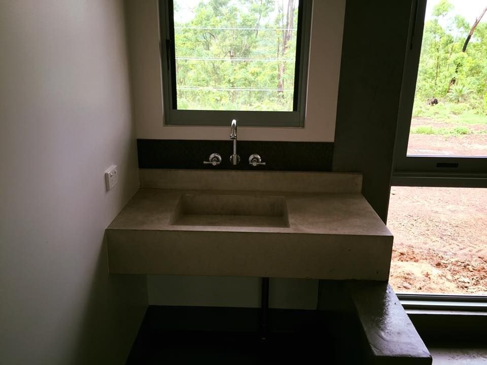 A Bathroom Sink With A Window In The Background — SLS Builders Pty Ltd in Humpty Doo, NT