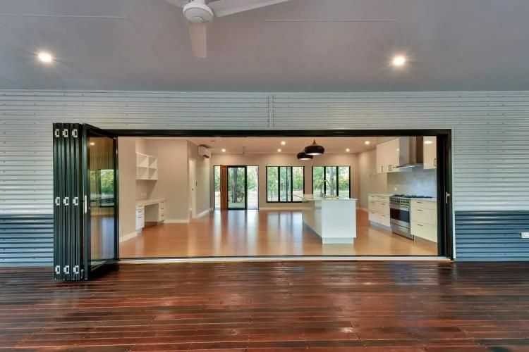 A Kitchen With a Lot of Windows and a Ceiling Fan — SLS Builders Pty Ltd in Humpty Doo, NT