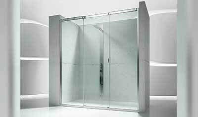 Cabina de ducha de cristal con puertas correderas en un baño moderno.