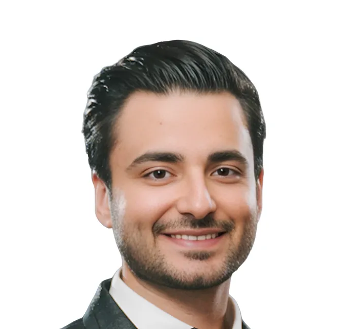 Portrait of a smiling man in a dark blazer on a white background