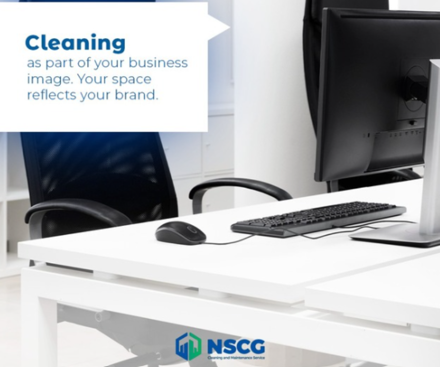 Office desk with monitor and keyboard, featuring a “Cleaning” message and NSCG logo. Office desk with monitor and keyboard, featuring a “Cleaning” message and NSCG logo.