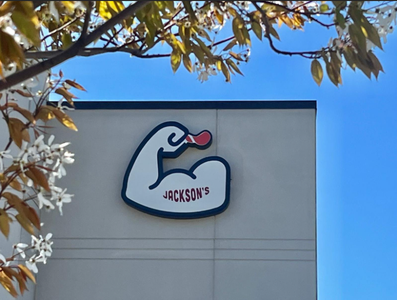 Jackson's restaurant sign: a flexing arm logo of a duck with the word 