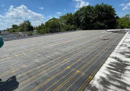 Rhino Brothers Roofing Commercial Synthetic Polymer Flat Roof in Livonia
