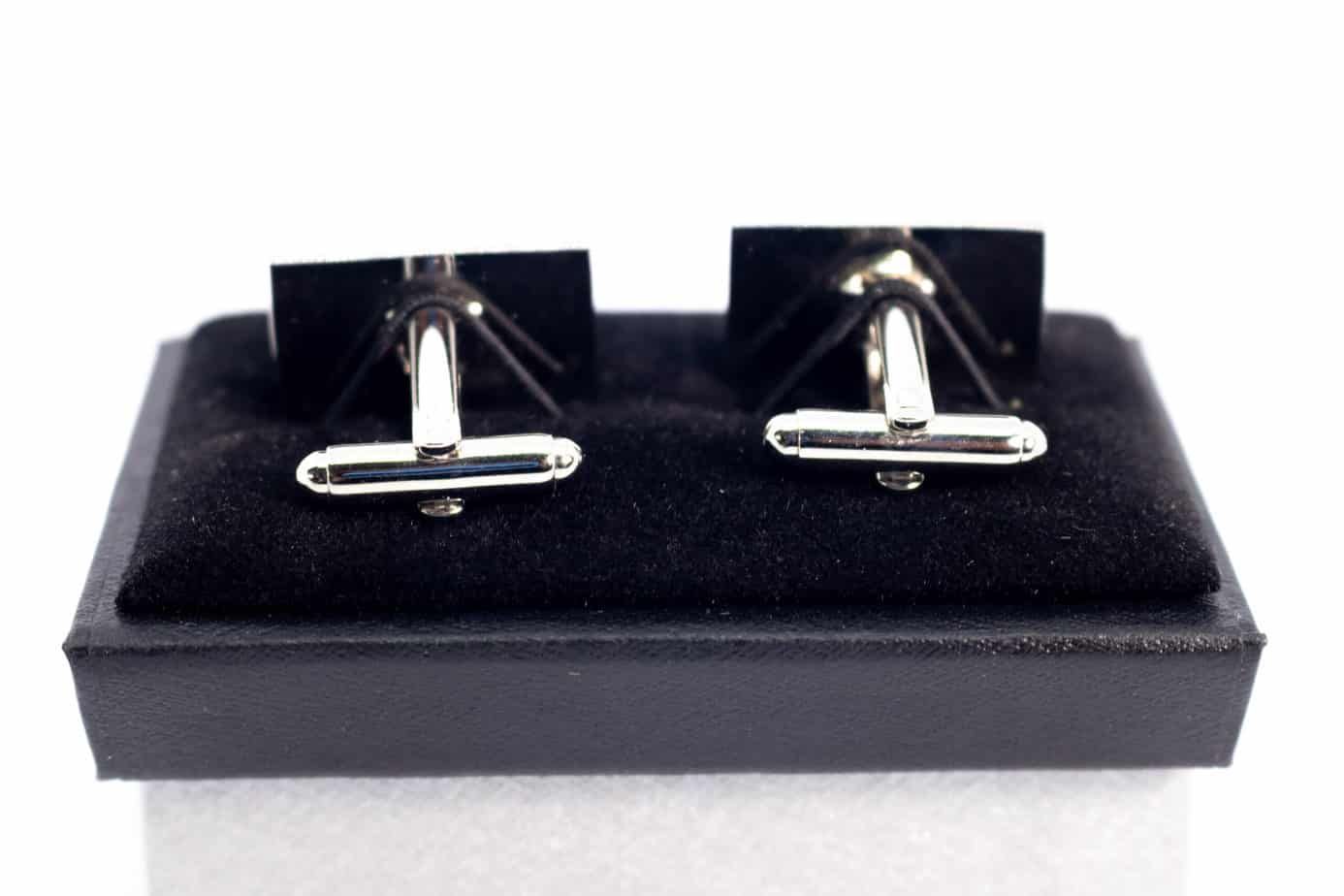 Thin blue line cufflinks in a display box.