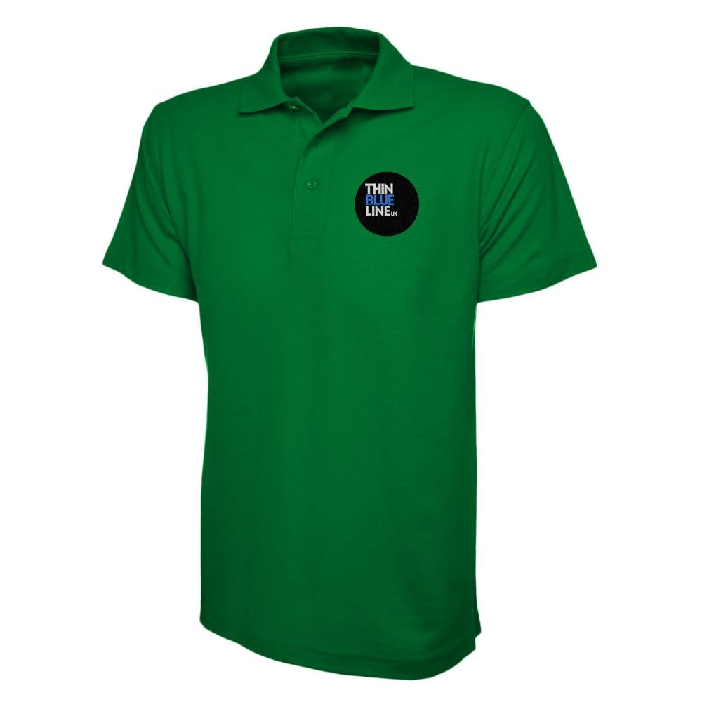 Green polo shirt with a black circular logo that says 